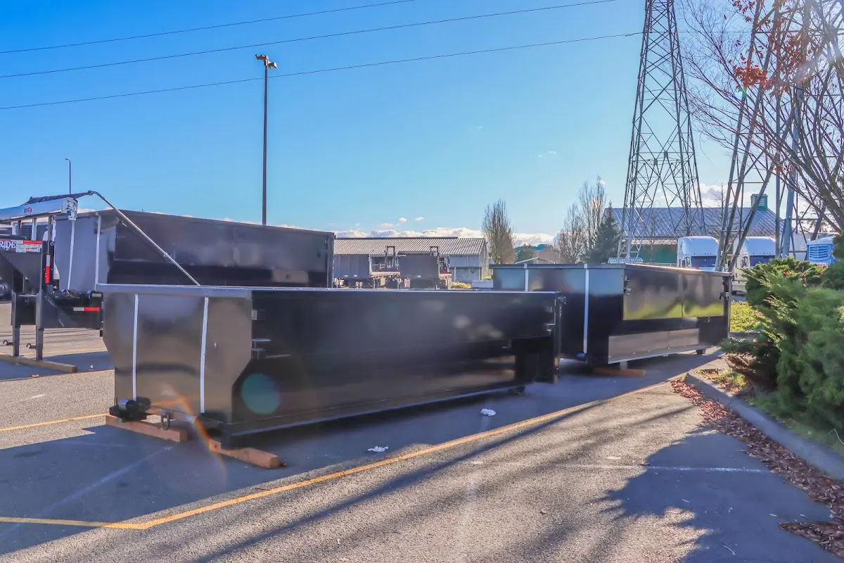 Roll-off dumpster ready for waste disposal at job site for 2 Yard Dumpster Rental in Monmouth